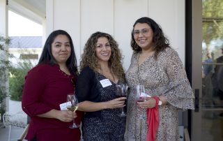 3 women with wine at event